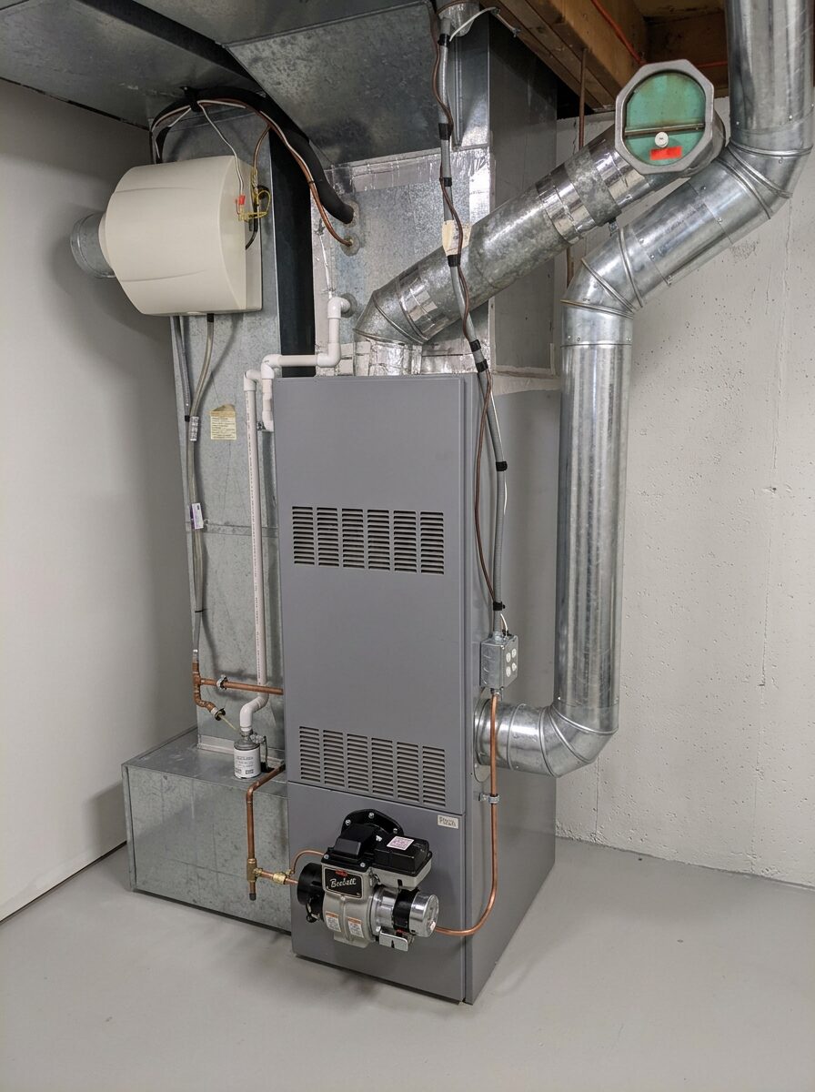 Hot air furnace with new plenum and return ductwork in a basement